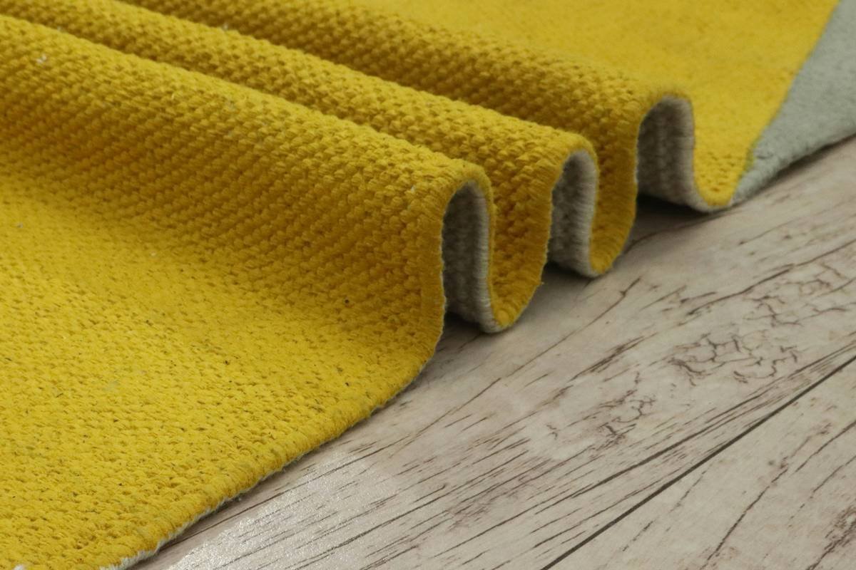 comparison showing worn-out low-density vs resilient high-density padding for under carpet after 2 years