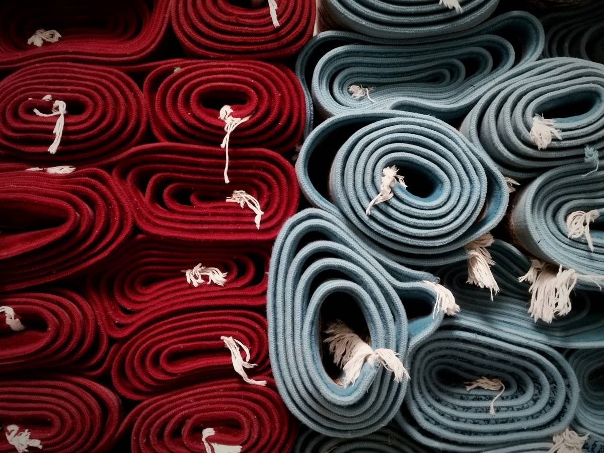 what is carpet pad shown as cross-section of layered flooring with foam under carpet fibers